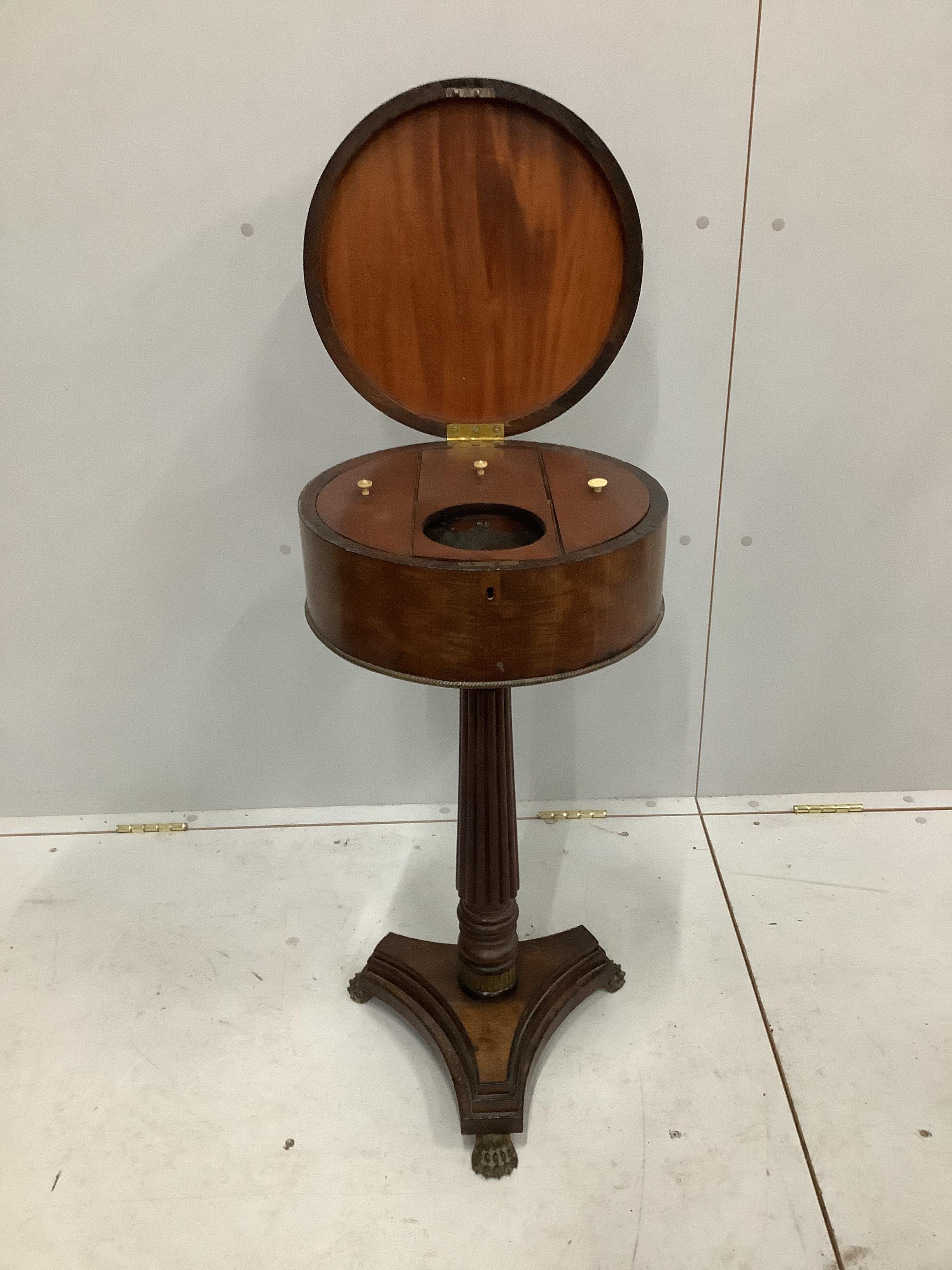 A Regency circular mahogany teapoy, diameter 36cm, height 76cm